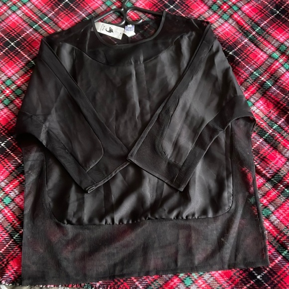 A black three quarter long sleeve women’s blouse with silk and sheer design. - Picture 1 of 7